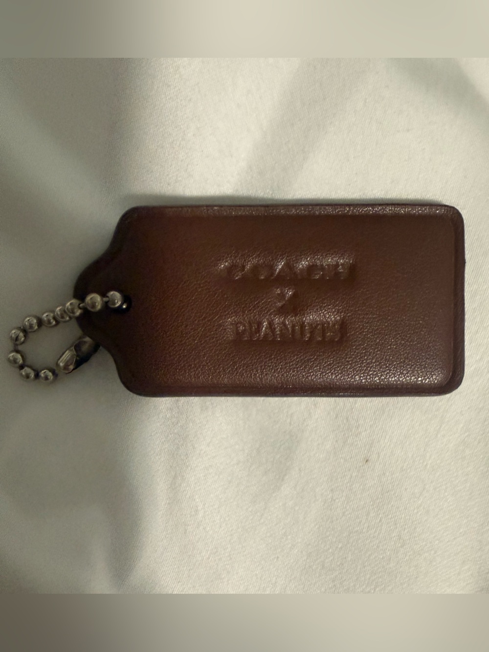 Coach and Peanuts Collab brown Hangtag!